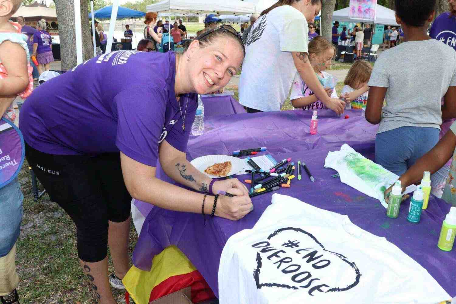 a woman writing on t shirt